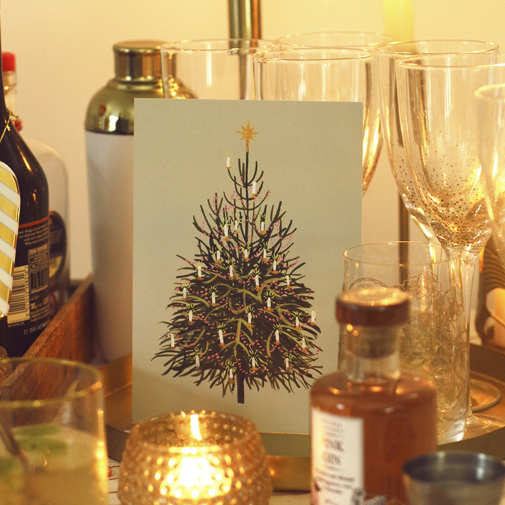 the christmas tree mini print nestled amongst the christmas drinks table