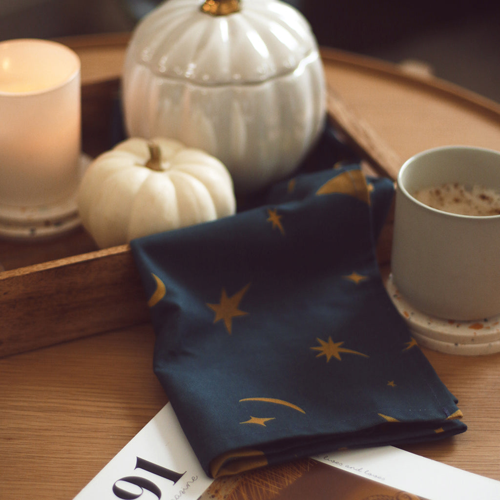 a magical, moon and star patterned kitchen tea towel