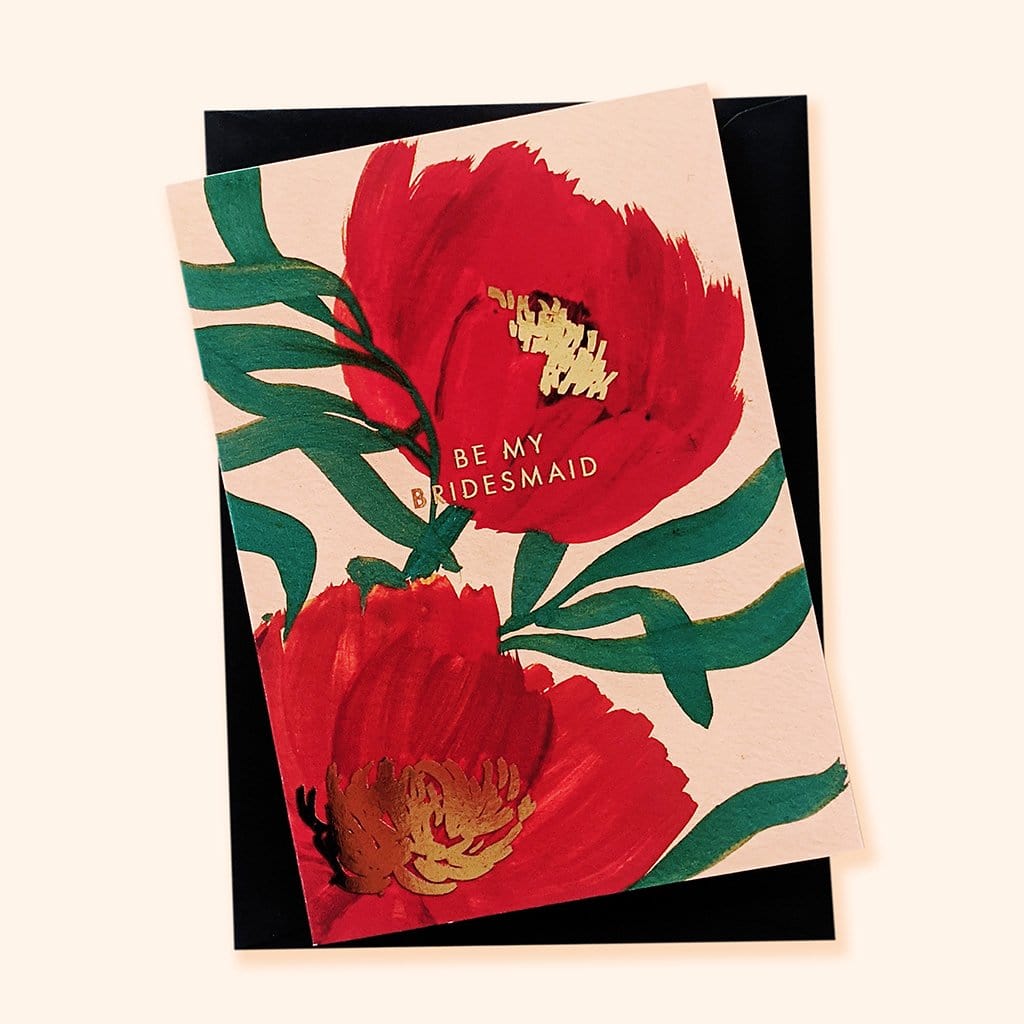 A Floral A6 Card with Red Green And Gold Flowers With Be My Bridesmaid In Gold Lettering With Black Envelope - Annie Dornan Smith