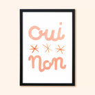 Typographic Print With The Words Oui Non And Three Stars In Peach In A Black Frame - Annie Dornan Smith