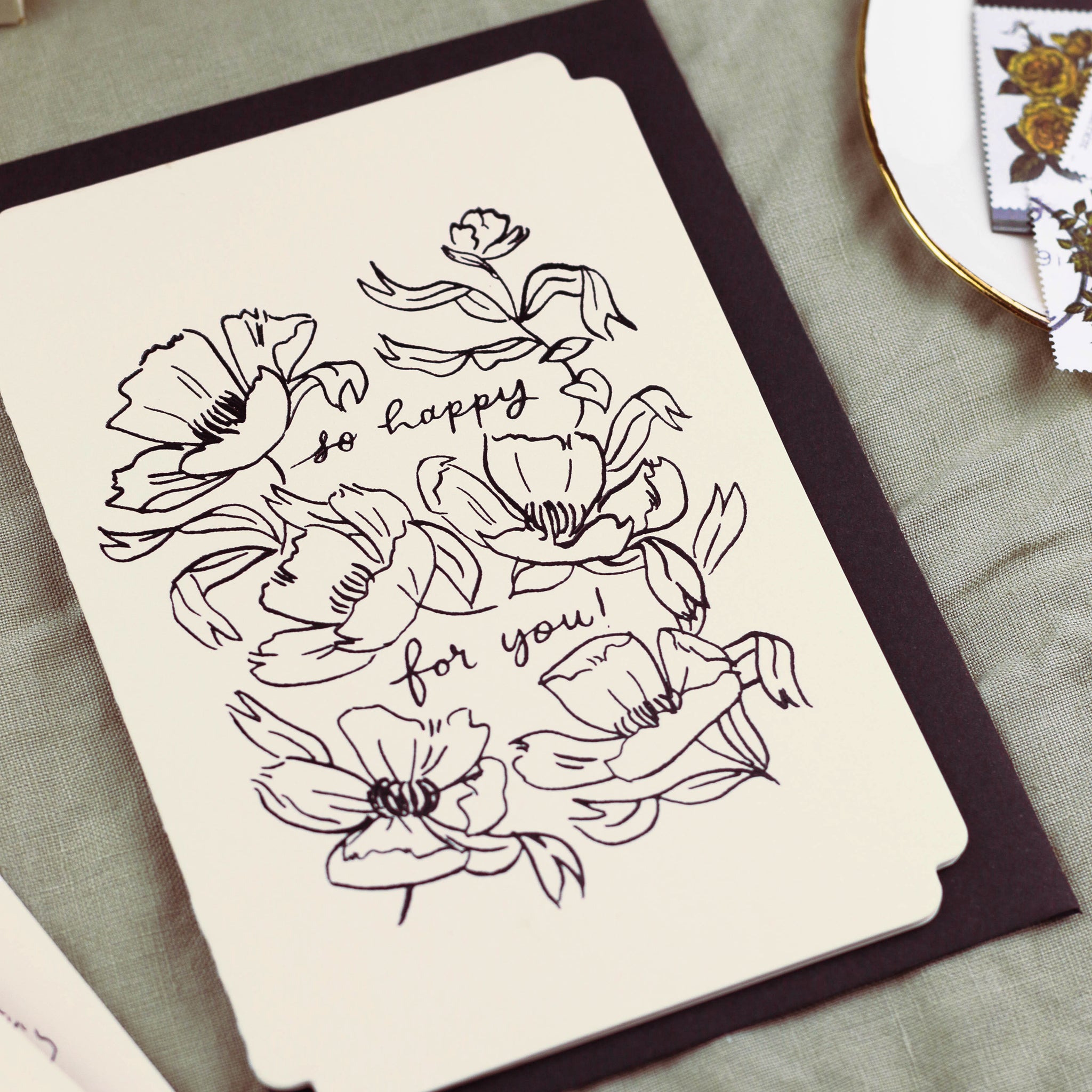 Detail of black foiling on this floral congratulations card.