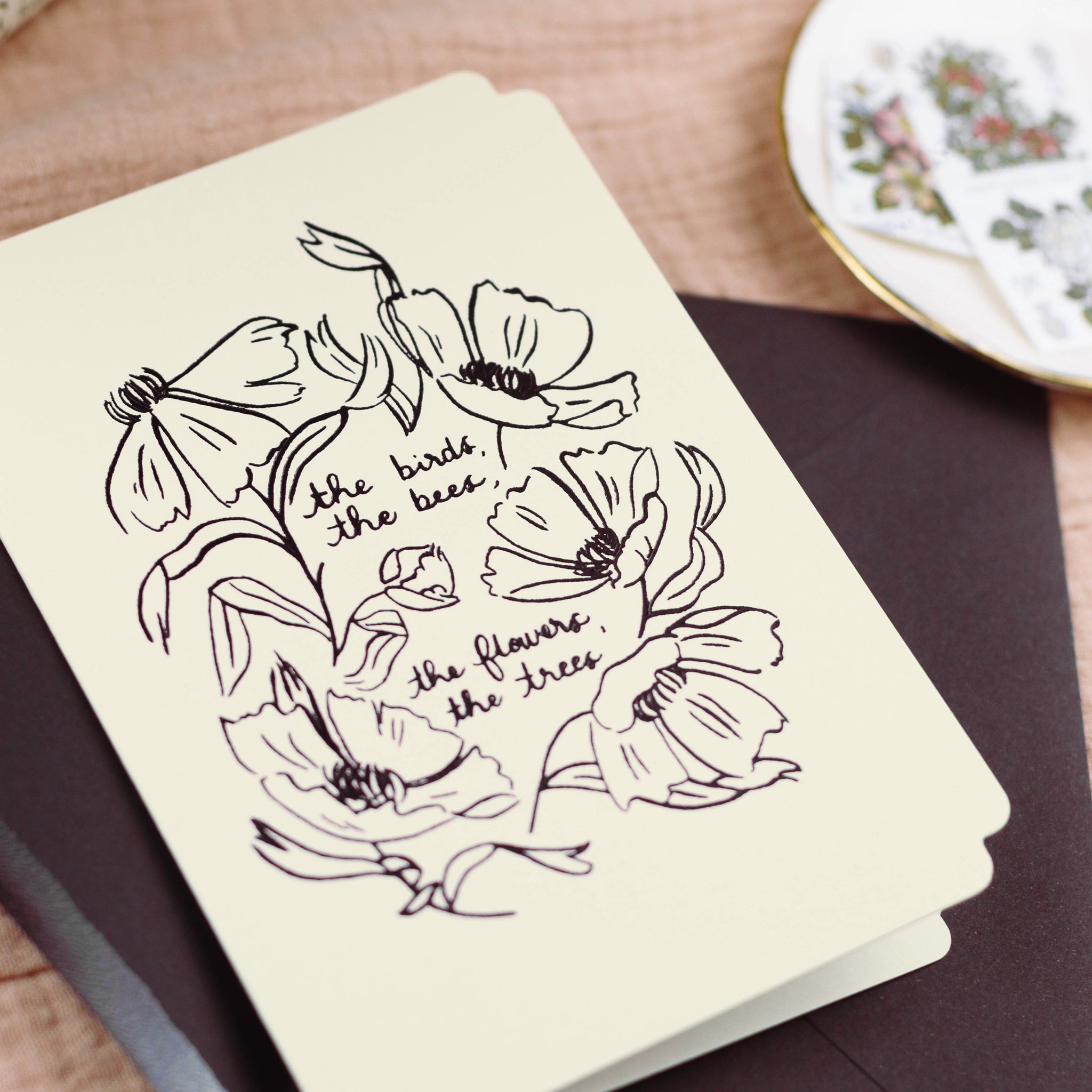 A just because card for nature lovers made with black embossed foil and cream card.