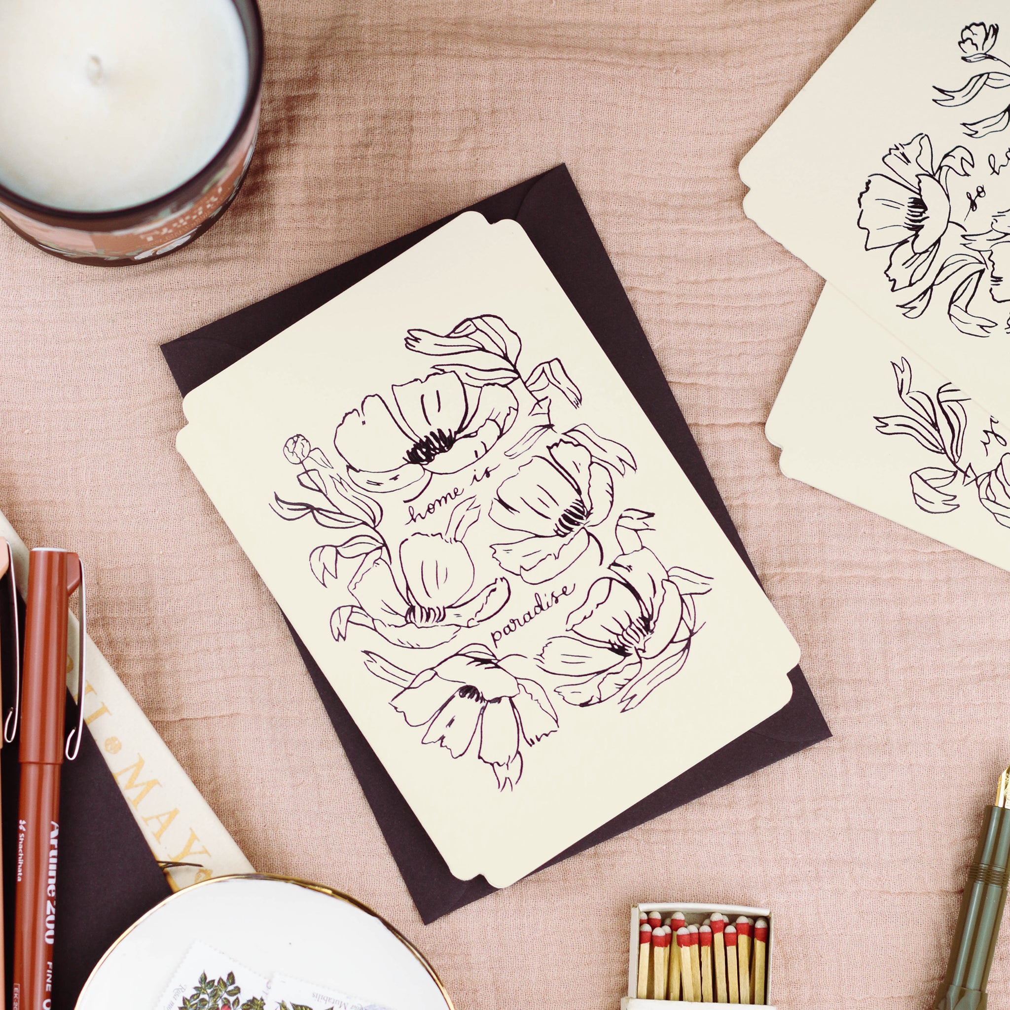 a floral card reads "home is paradise" surrounded by elegant linework flowers