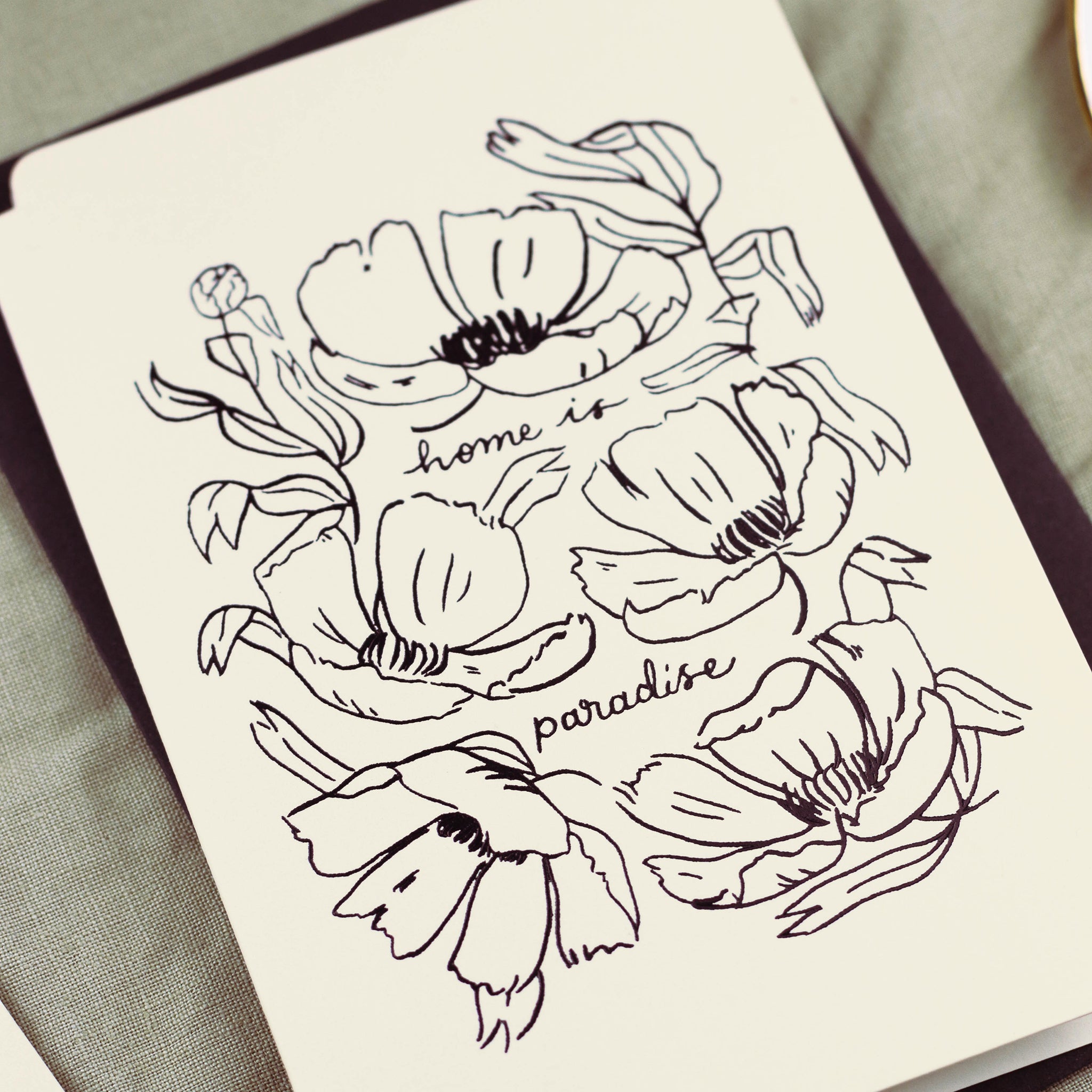a floral card reads "home is paradise" surrounded by elegant linework flowers