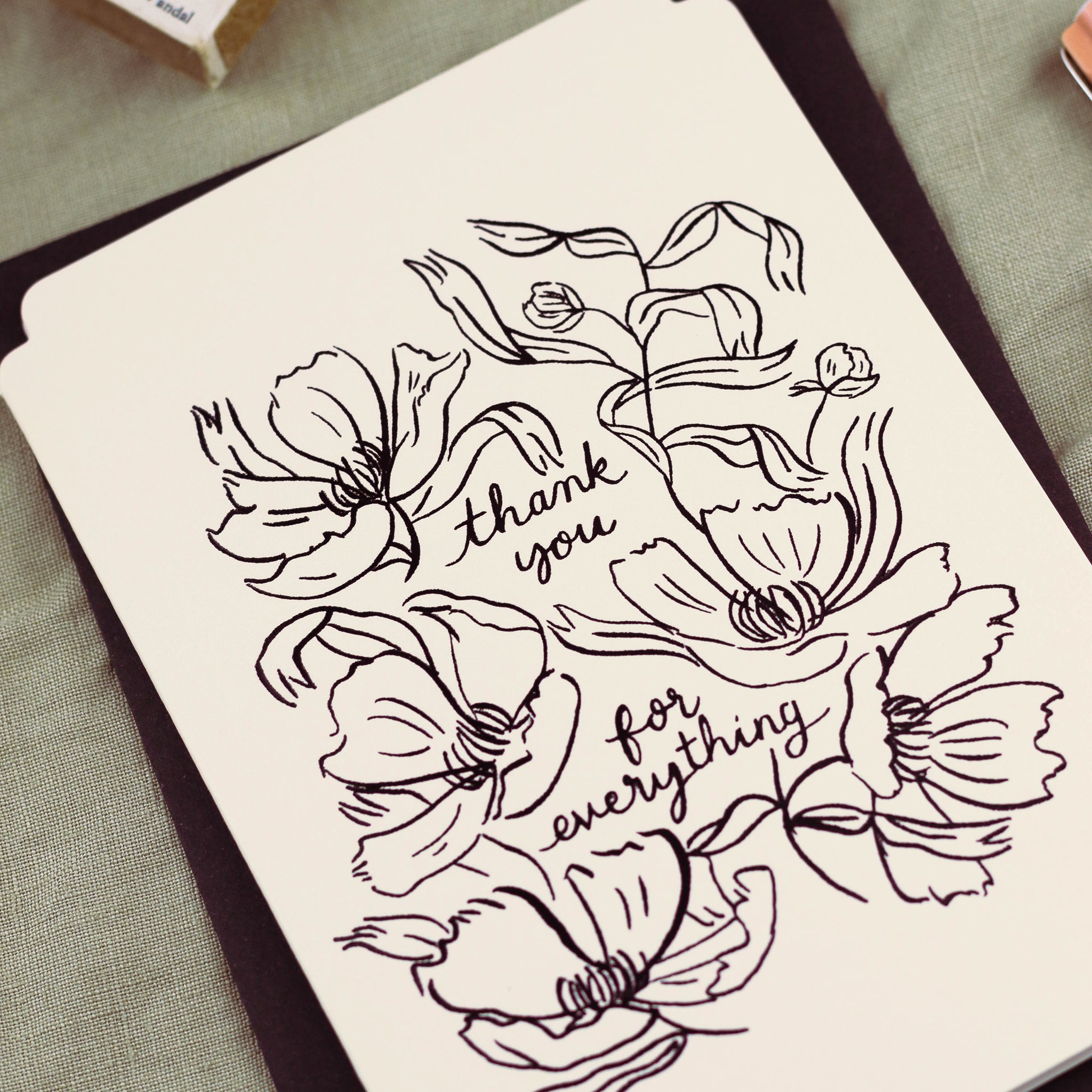 detail of the black foiled flowers and lettering on this floral thank you card - Annie Dornan Smith