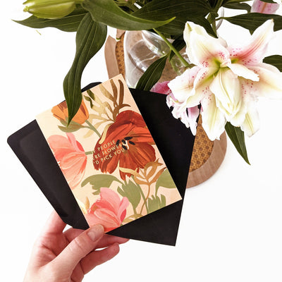 A Floral A6 Card with Red Green Pink And Orange Flowers And Gold Flowers With If People Were Flowers I'd Pick You In Gold Lettering With Black Envelope - Annie Dornan Smith