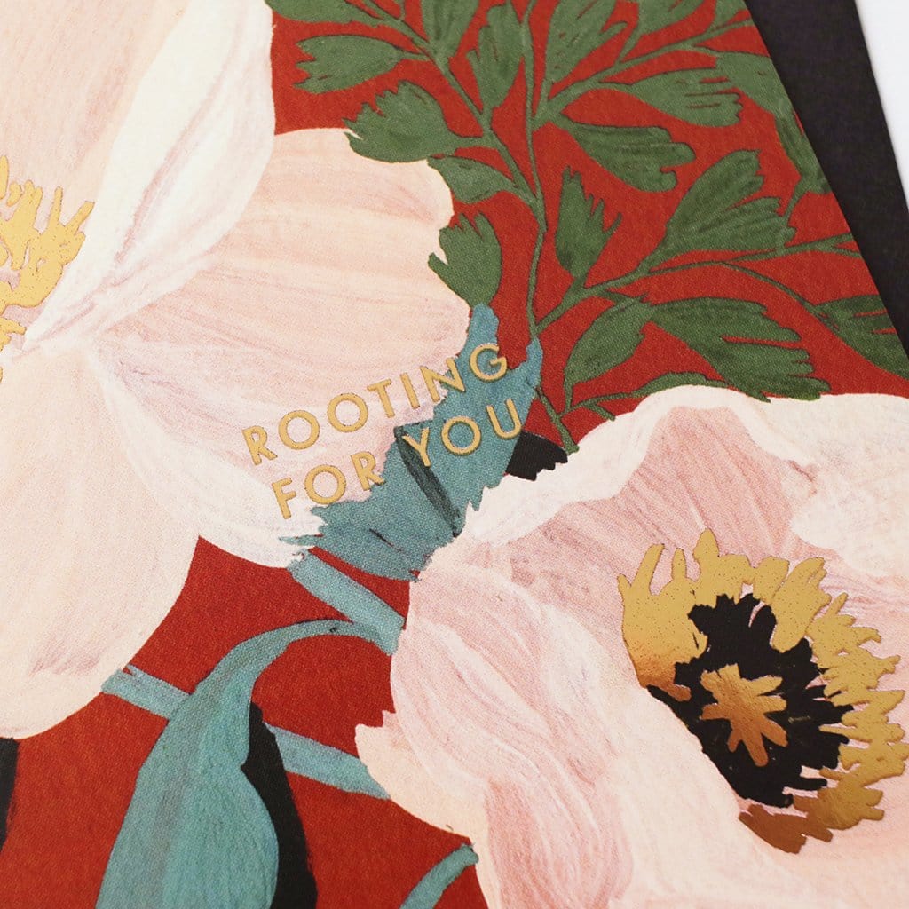 Close up Of A Floral A6 Card with Pastel Pink Green And Gold Flowers With Rooting For You In Gold Lettering With Black Envelope - Annie Dornan Smith