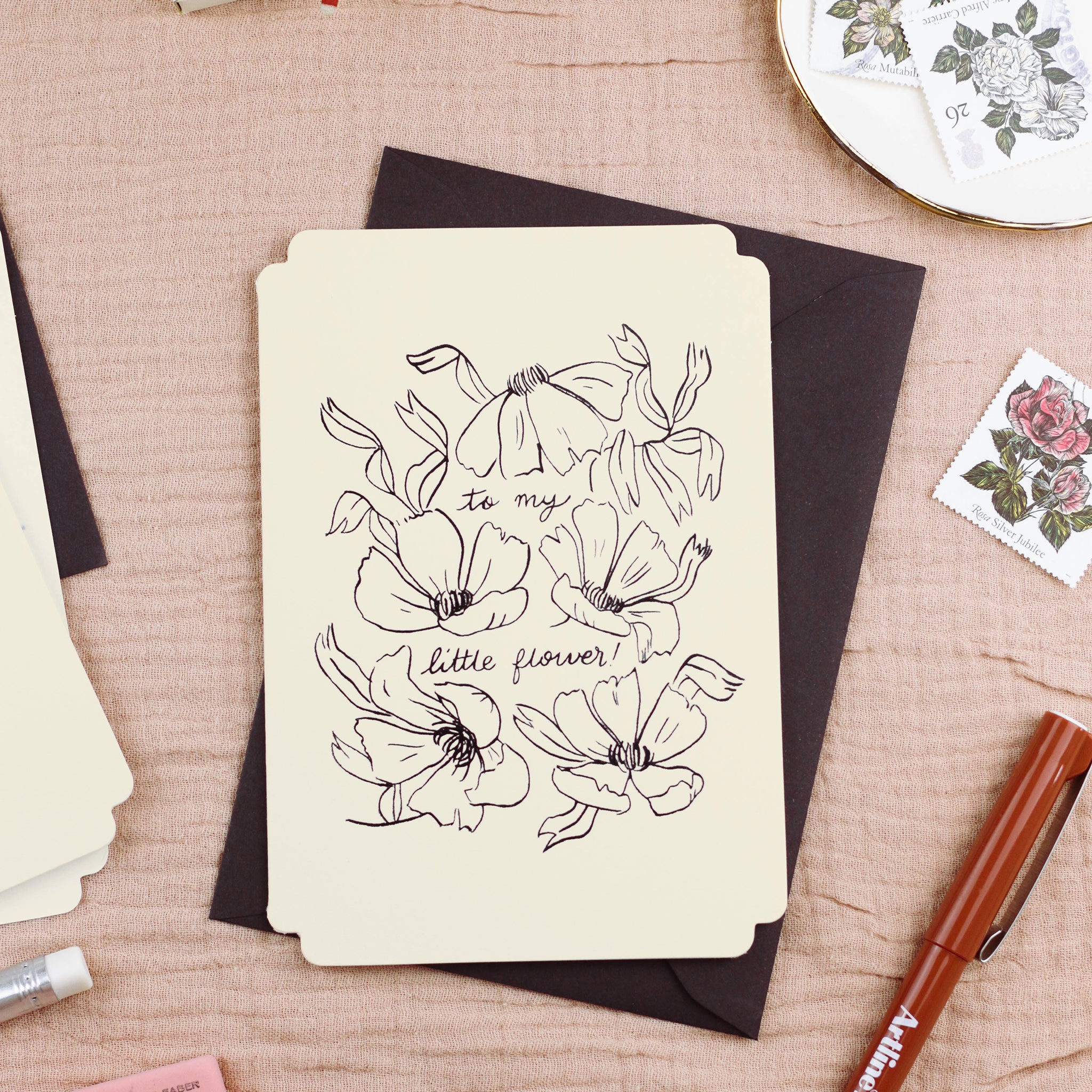 a floral daughter / granddaughter card, styled with a black envelope, vintage stamps and writing accoutrements. Black Line Floral Art Print Love You Beautiful In A Black Frame  - Annie Dornan Smith