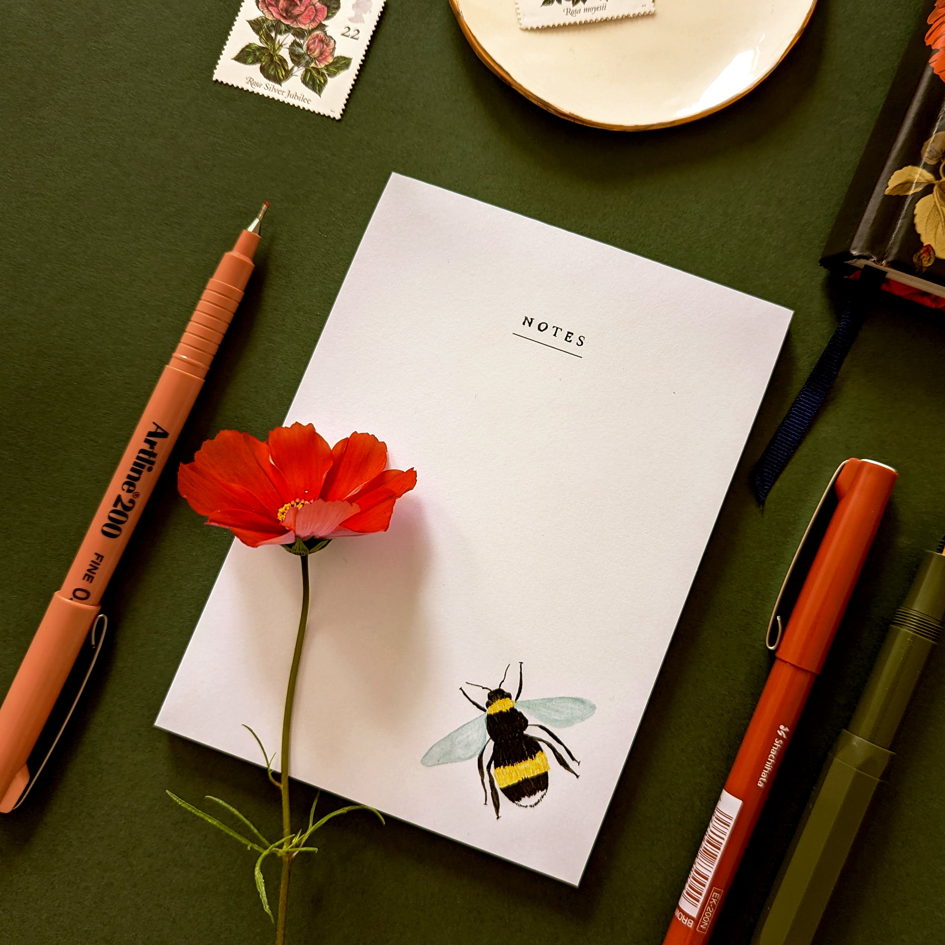 note pad with a illustrated bee design