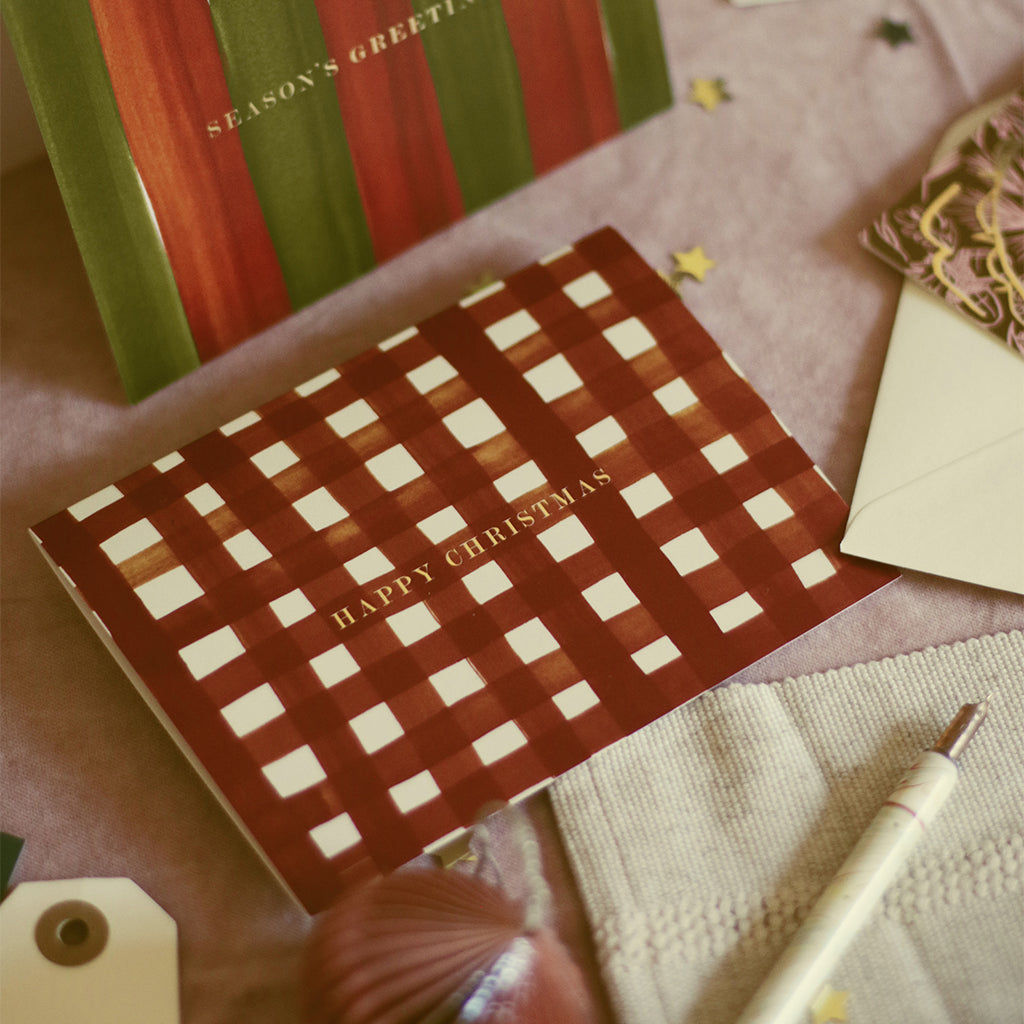 christmas cards in traditional green and red hues with gold foil lettering