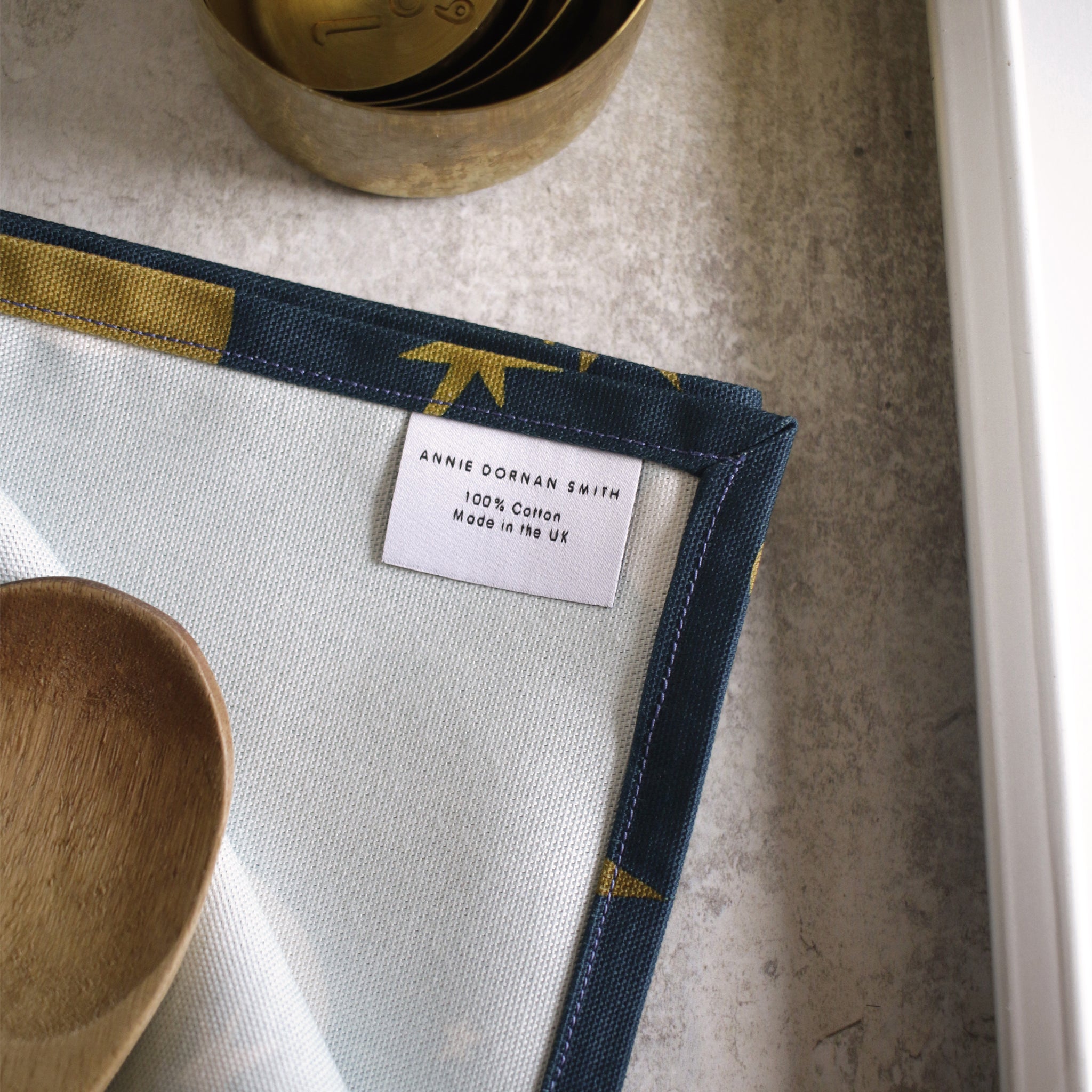 100% cotton, made in the UK tea towel - label close up