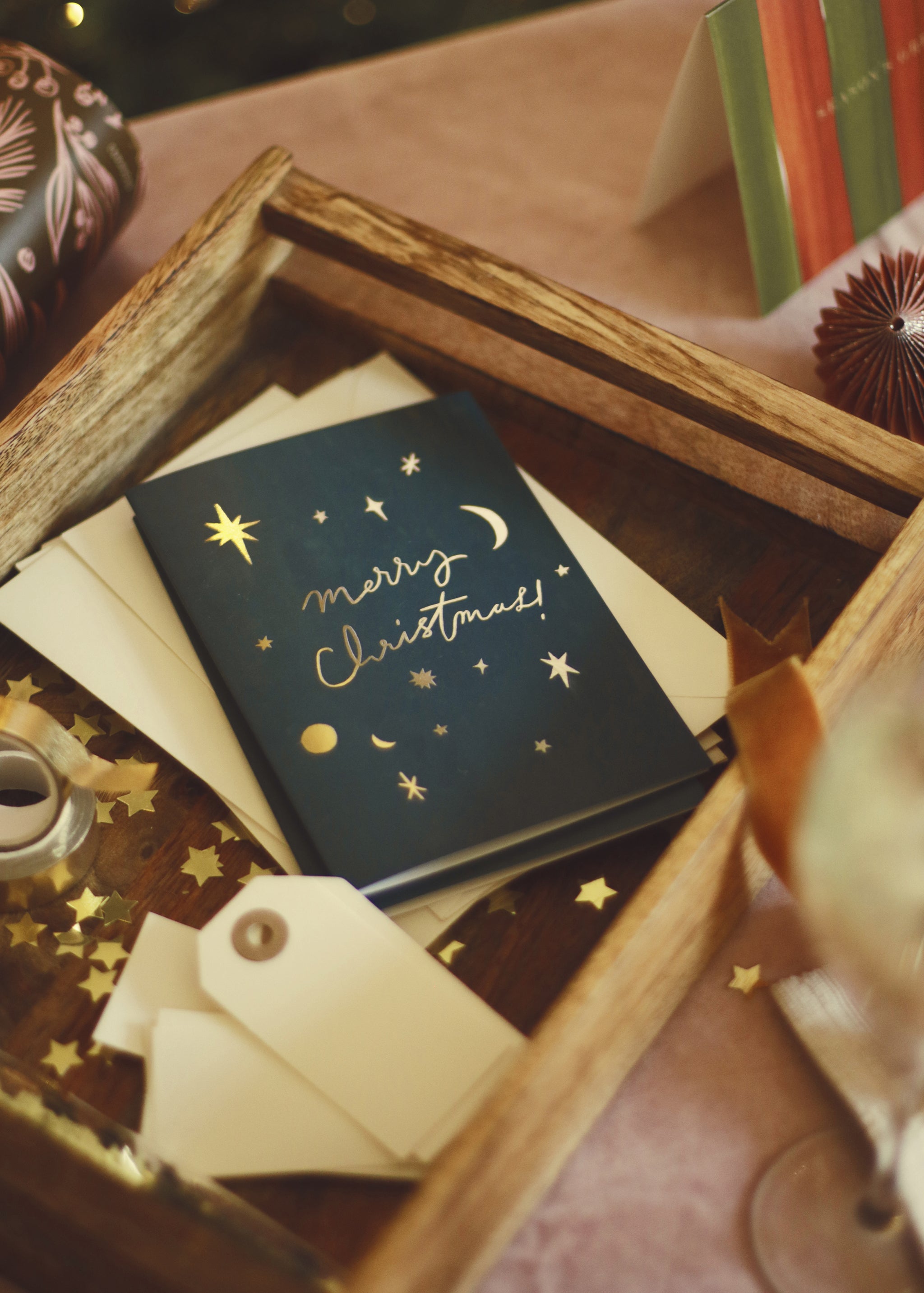 a tray of celetial christmas cards and envelopes, and writing supplies, ready to write!