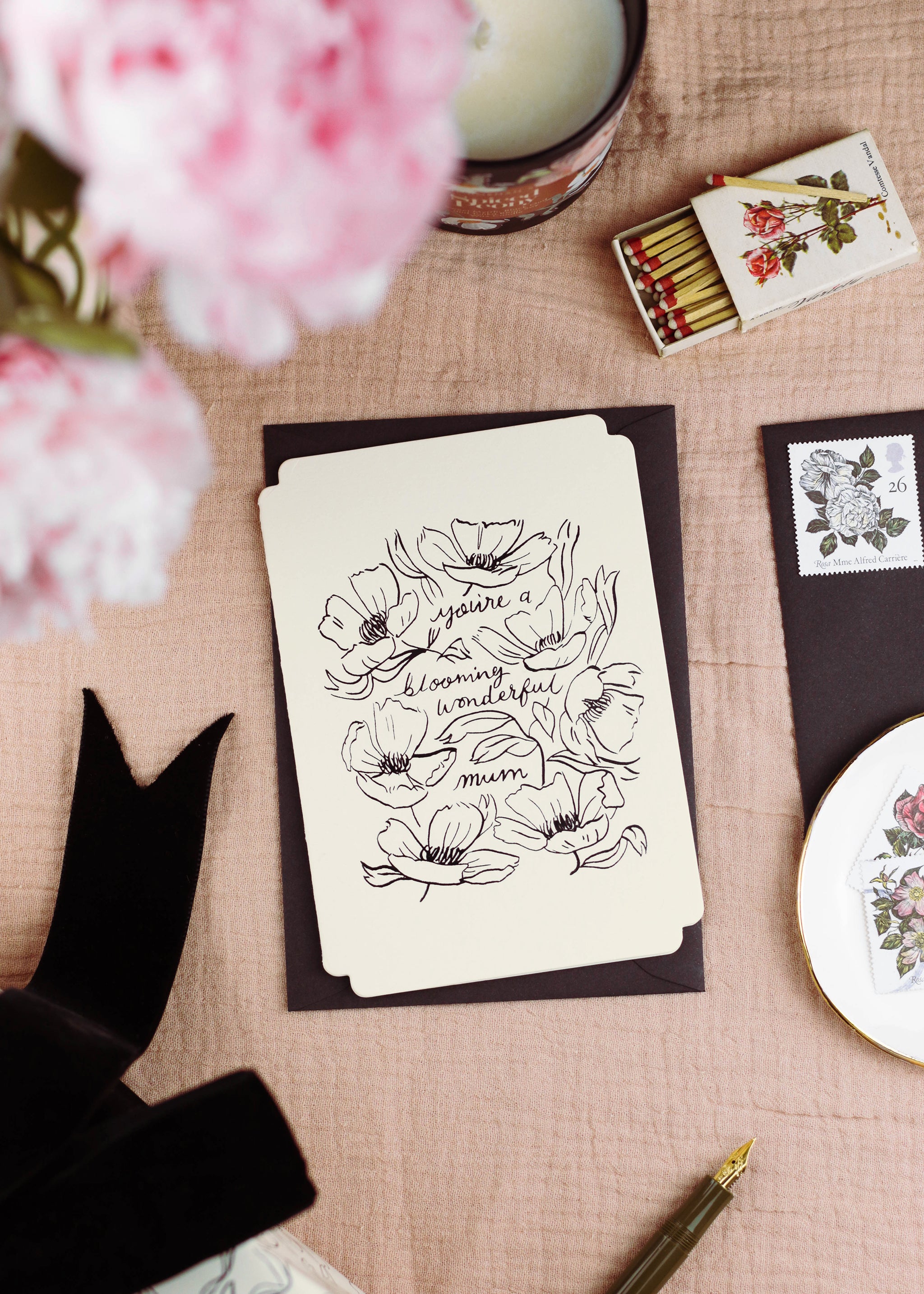 A floral mother's day card with linework-style floral design reads "you're a blooming wonderful mum" comes with a black envelope. - Annie Dornan Smith