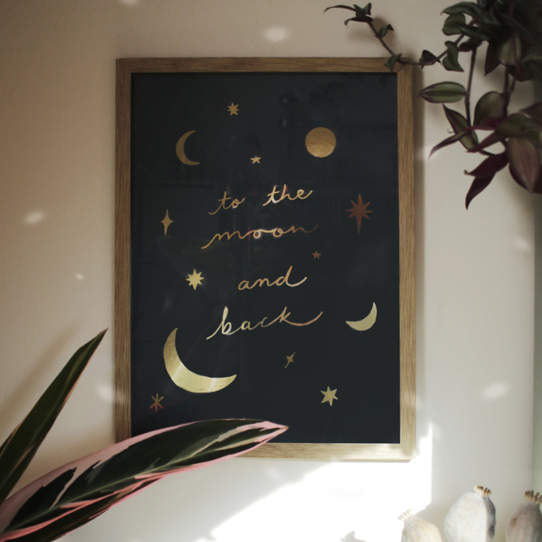 moon and back gold foul print in oak frame