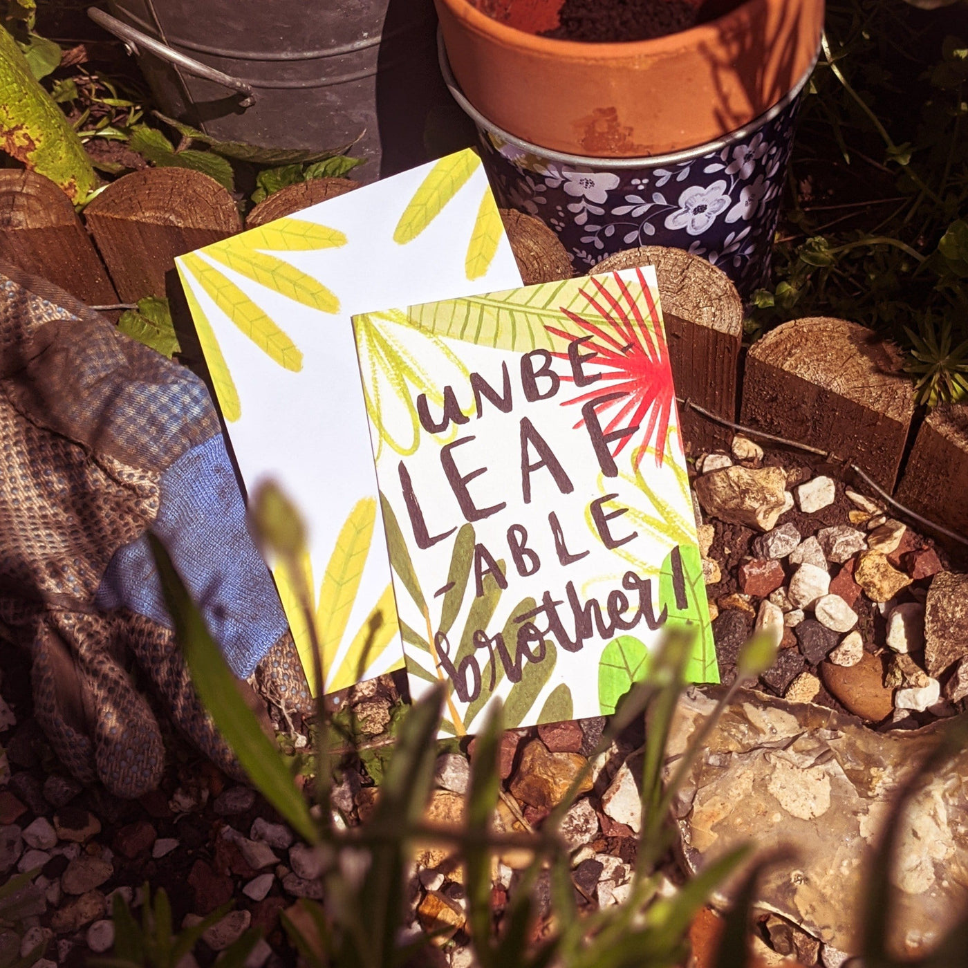 A plant themed gardening card surrounded by plant pots