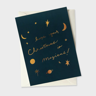 a magical themed christmas card covered in gold foil moons and stars