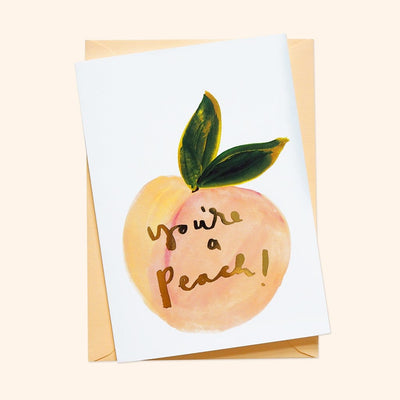 An Illustrated Care With A Peach And Green Leaf With The Words You're A Peach In Gold With A Peach Envelope - Annie Dornan Smith
