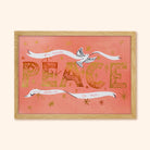 Coral Christmas Print With Gold Peace Lettering And Stars With A White Ribbon And Dove In An Oak Frame - Annie Dornan Smith