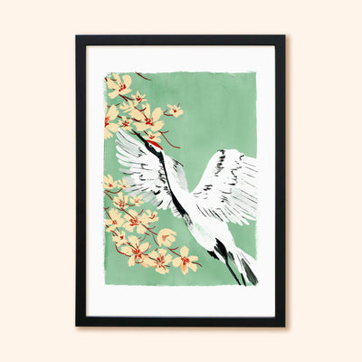 A Full Colour Giclee Print Featuring a Crane And Cherry Blossom On A Teal Background In A Black Frame - Annie Dornan Smith