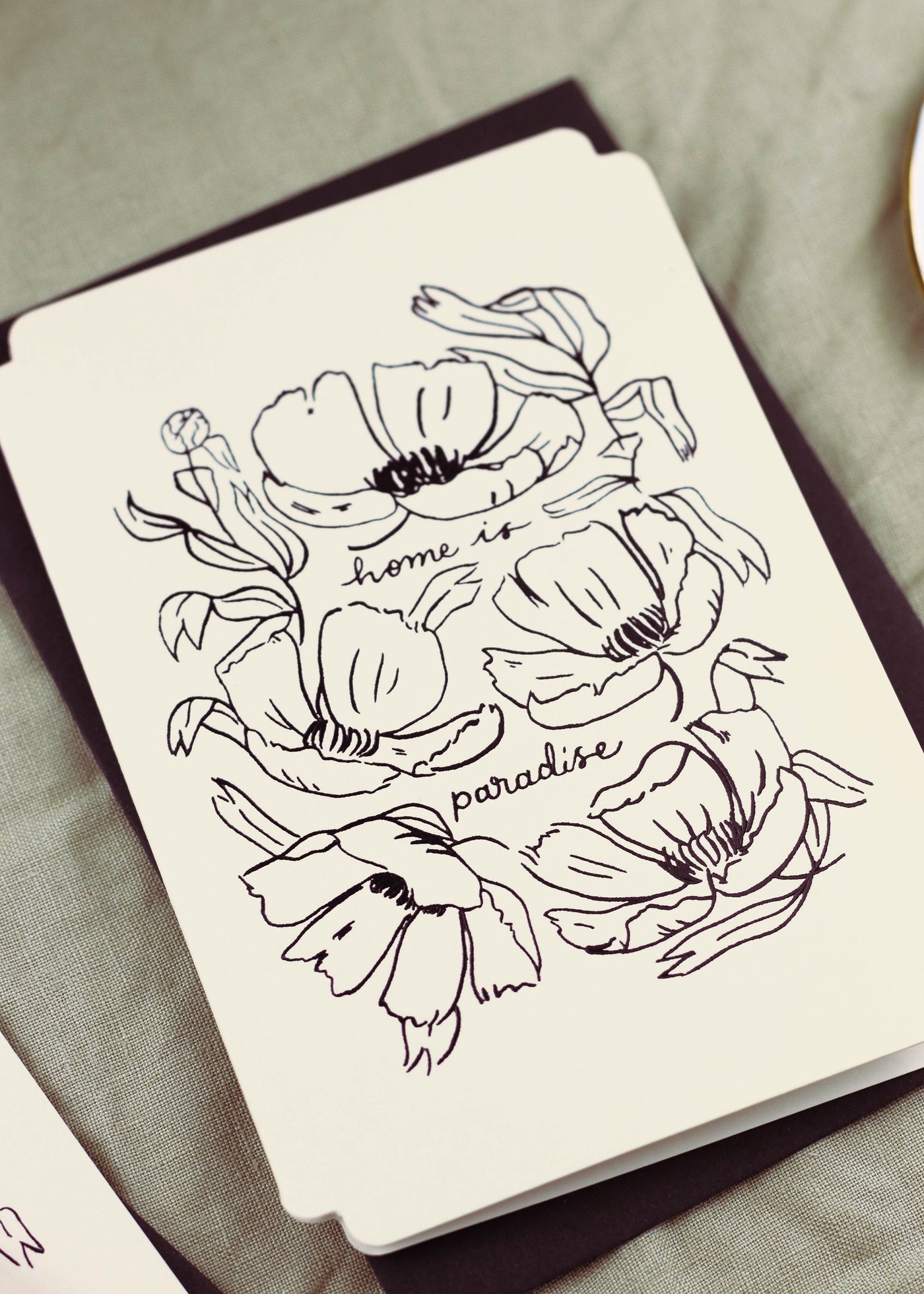 a floral card reads "home is paradise" surrounded by elegant linework flowers