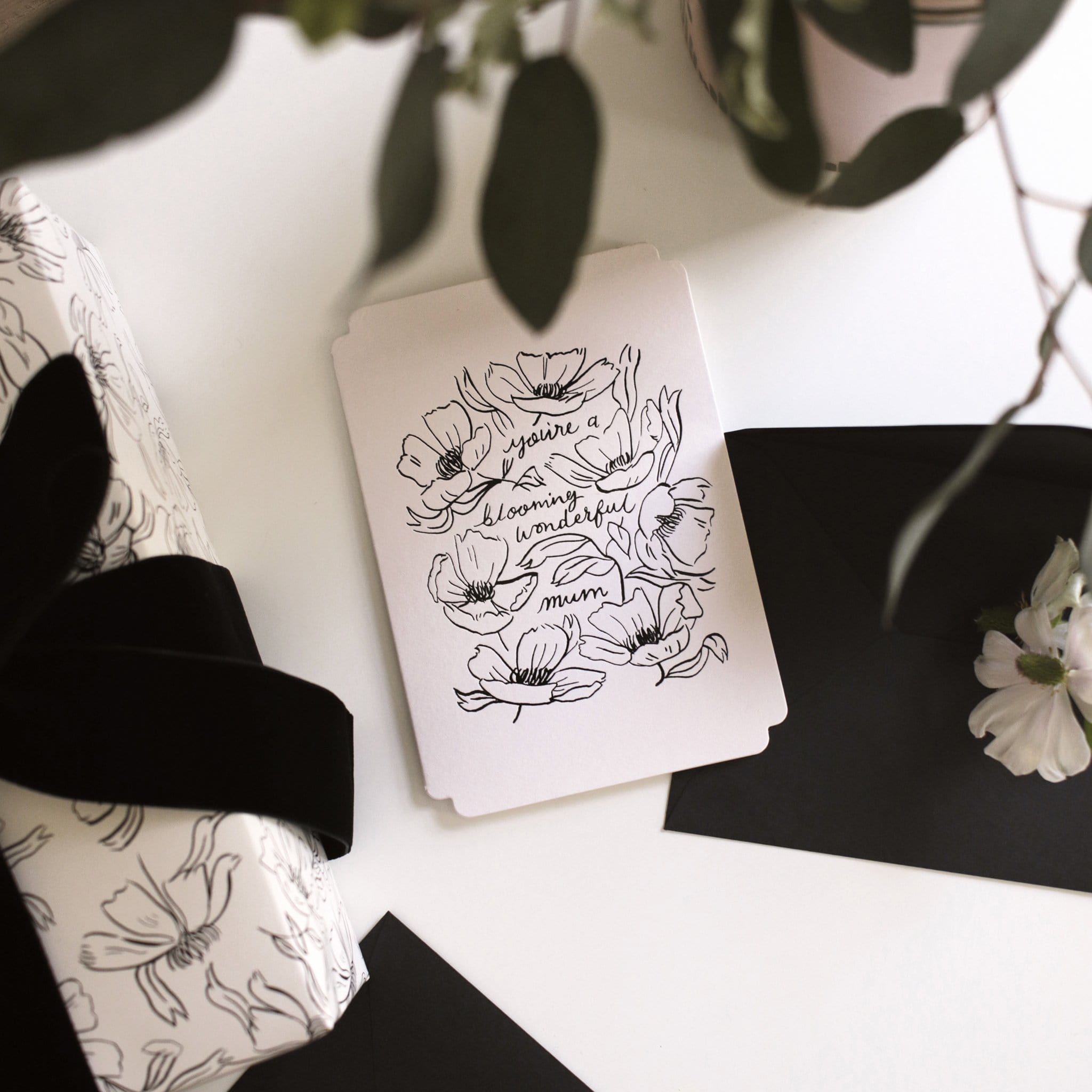 Black Floral Line Art Work A6 White Card  With The Words You're Blooming Wonderful Mum Coupled With A Black Envelope - Annie Dornan Smith
