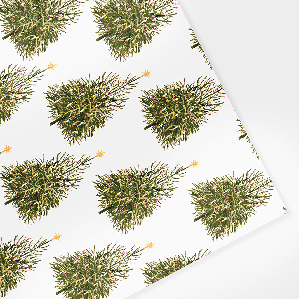 illustrated christmas tree patterned wrapping paper, featuring a painted christmas tree decorated with candles and garlands, against an off-white background