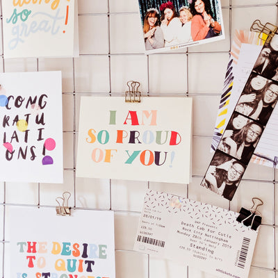 A Hand Lettered Rainbow Typography Card Which Reads I Am So Proud Of You Attached To A Noticeboard - Annie Dornan Smith