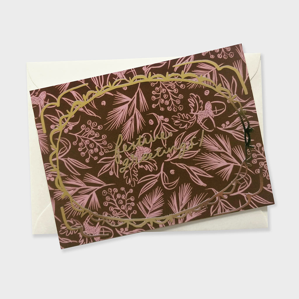 a luxue patterned christmas card with gold foil lettering and frame illustration