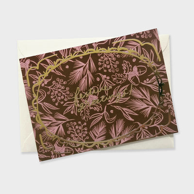 a luxue patterned christmas card with gold foil lettering and frame illustration