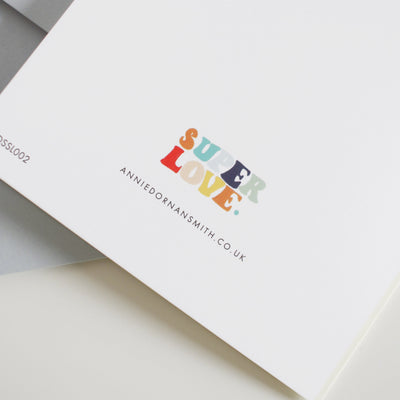 The Back Of Greeting Card With Super Love In Rainbow Colours And The Web Address - Annie Dornan-Smith Design