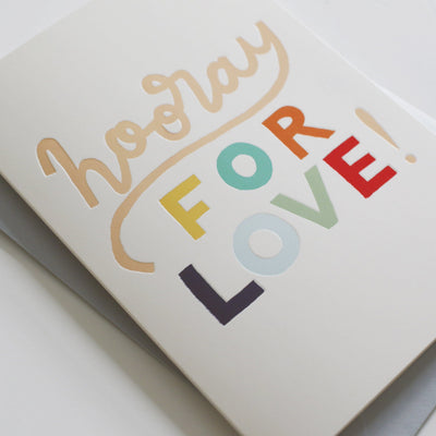 A Hand Lettered Rainbow Typography Card Which Reads Hooray For Love With Pale Grey Envelope - Annie Dornan Smith