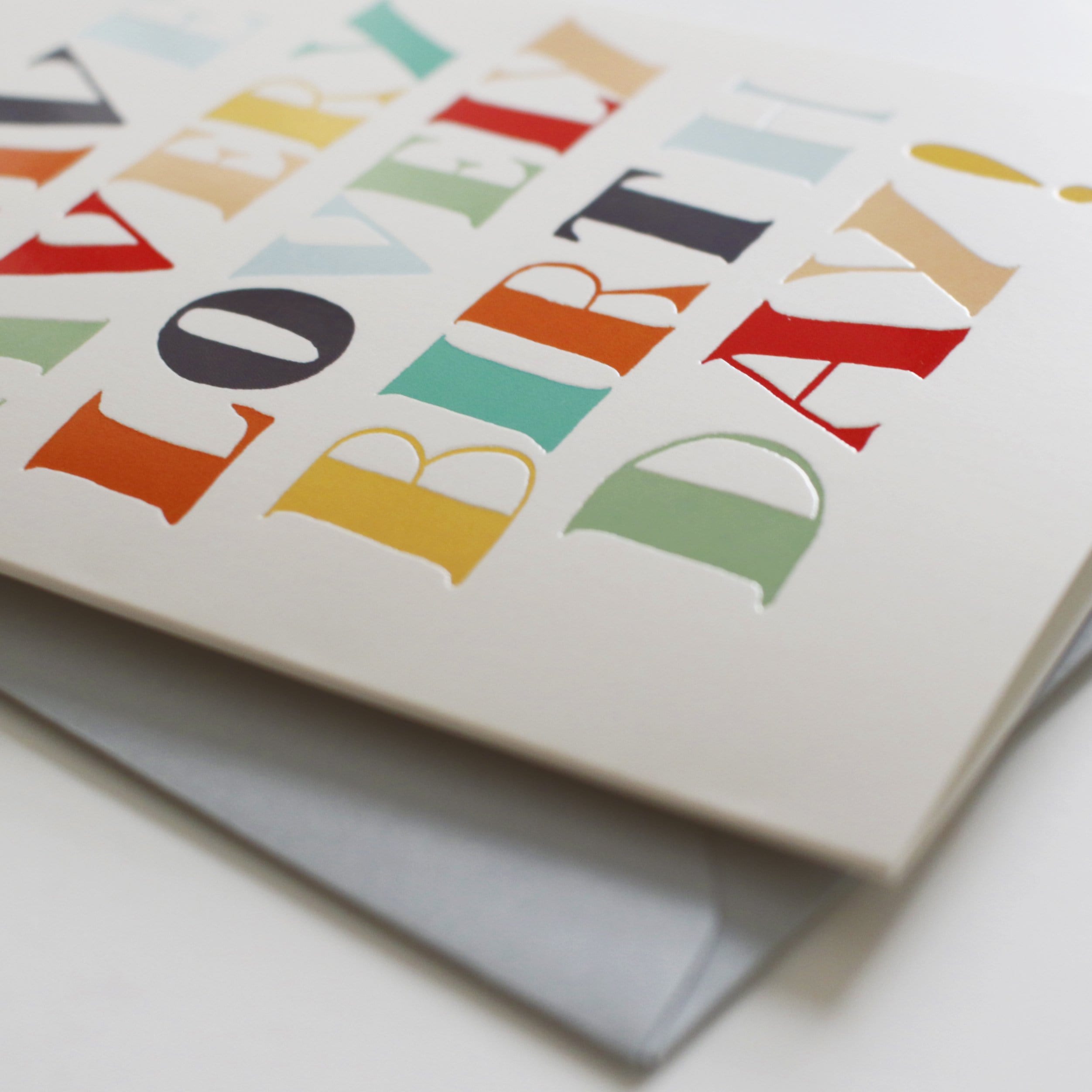 A Hand Lettered Rainbow Typography Card Reading Have A Very Lovely Birthday With A Pale Grey Envelope - Annie Dornan Smith