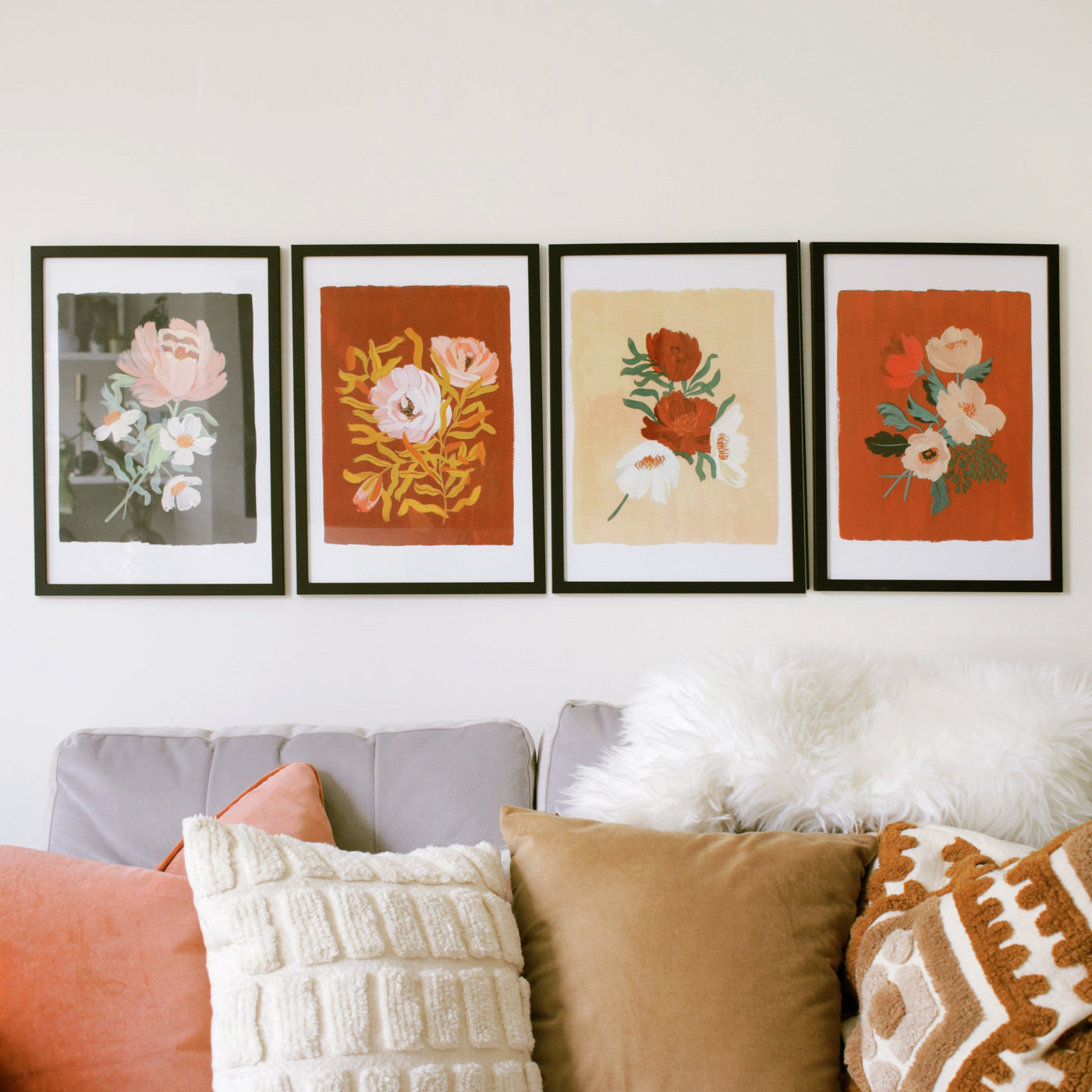 Red Floral Botanical Art Print With A Spray of Anemone Flowers On A Deep Red Background With Three Other Botanical Prints Hanging On The Wall - Annie Dornan Smith