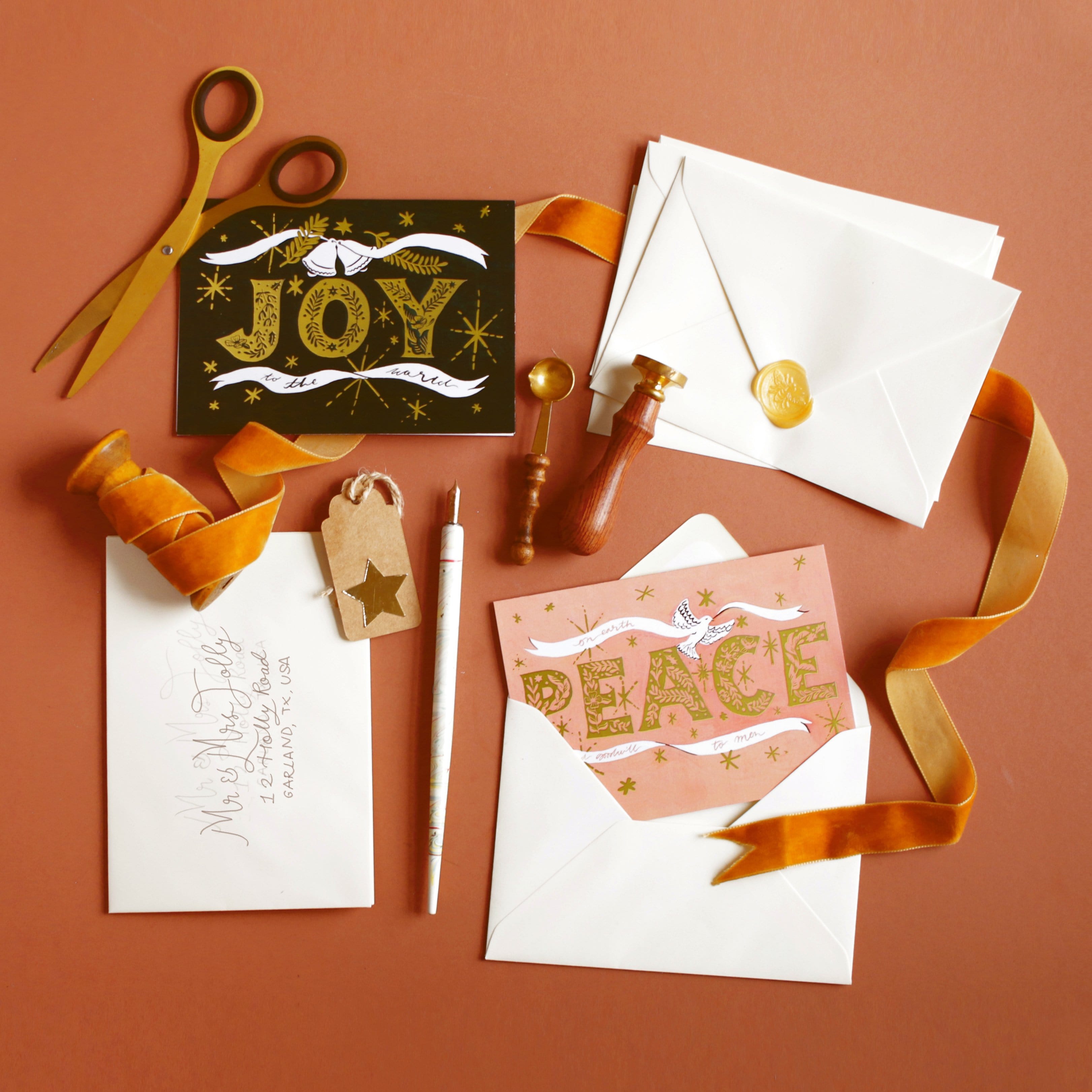 Black Christmas A6 Card With Gold Joy Lettering And Stars With Cream Envelope With Orange Ribbon And Gold Sissors - Annie Dornan Smith