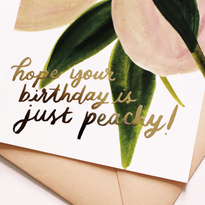 Illustrated Peach and Green Leaf A6 Card With Hope Your Birthday Is Just Peachy In Gold Lettering With Peach Envelope - Annie Dornan Smith