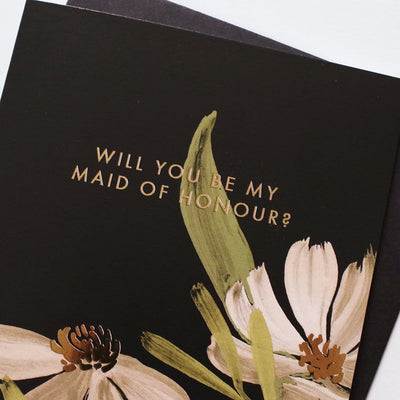 A Floral A6 Card With White And Green Flowers With Will You Be My Maid Of Honour In Gold Lettering  With Black Envelope - Annie Dornan Smith