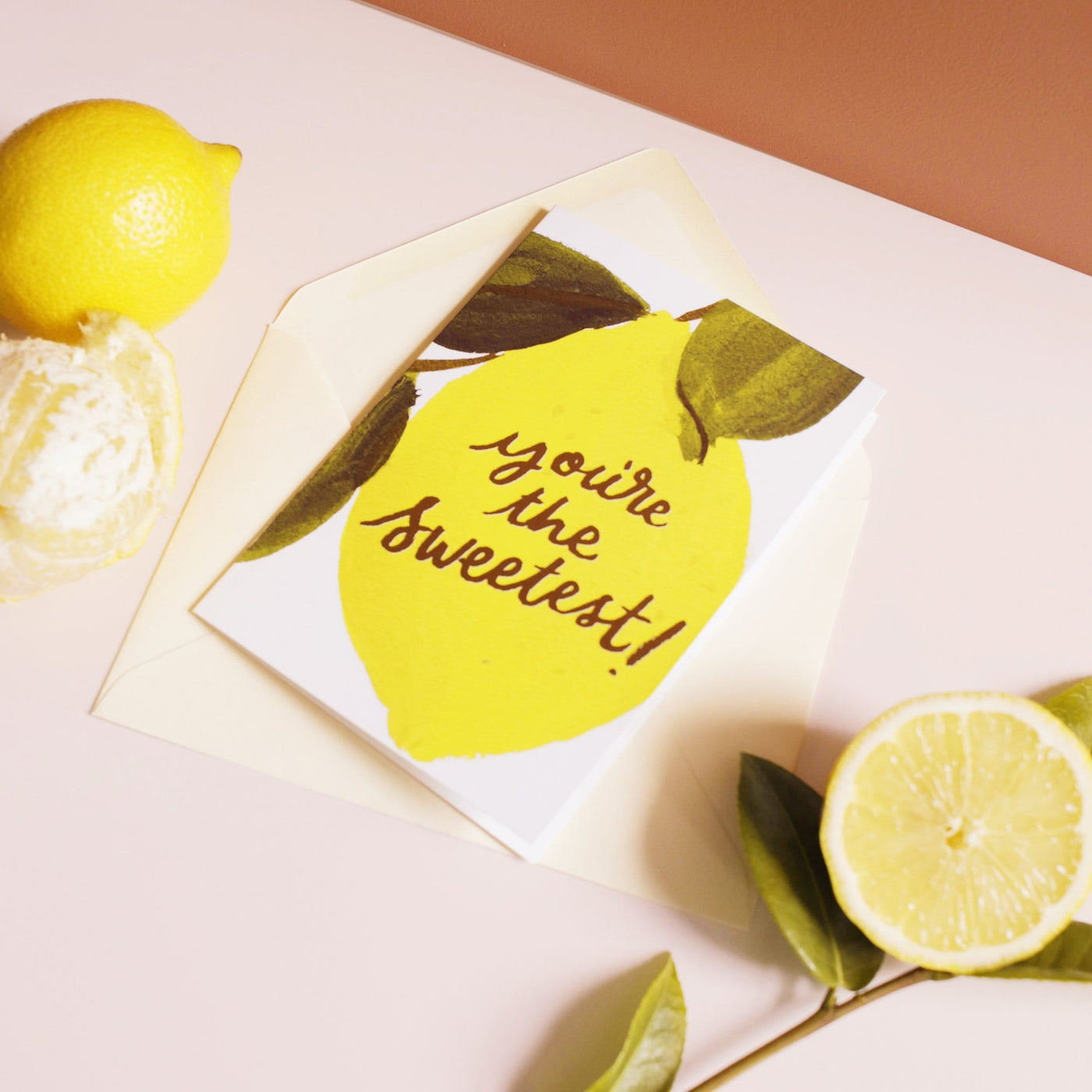 An Illustrated Lemon Card With The Words You're The Sweetest In Gold With A Pale Yellow Envelope - Annie Dornan Smith