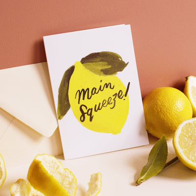 Illustrated Lemon and Green Leaf A6 Card With Main Squeeze In Gold Lettering With Pale Yellow Envelope With Real Lemons - Annie Dornan Smith