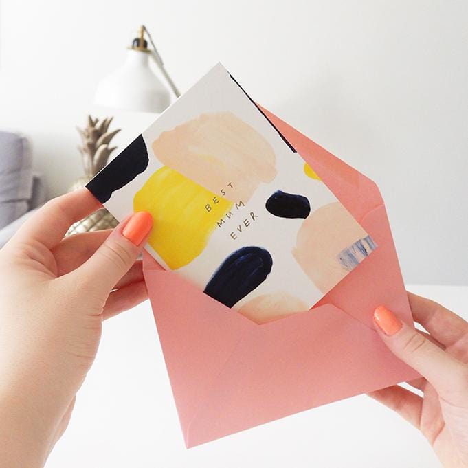 Paint Swatches In Pink Black And Yellow In An Abstract Design A6 White Card Reading Best Mum Ever Being Put Into A Pink Envelope - Annie Dornan Smith