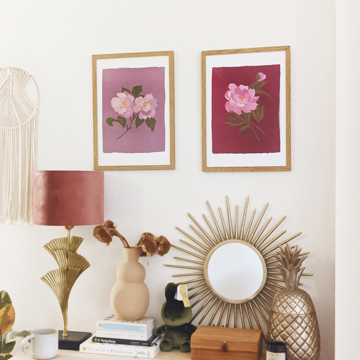 A Botanical Print Of A Pink Peony On A Burgundy Pink Background Hanging On A Wall With Another Botanical Print - Annie Dornan Smith