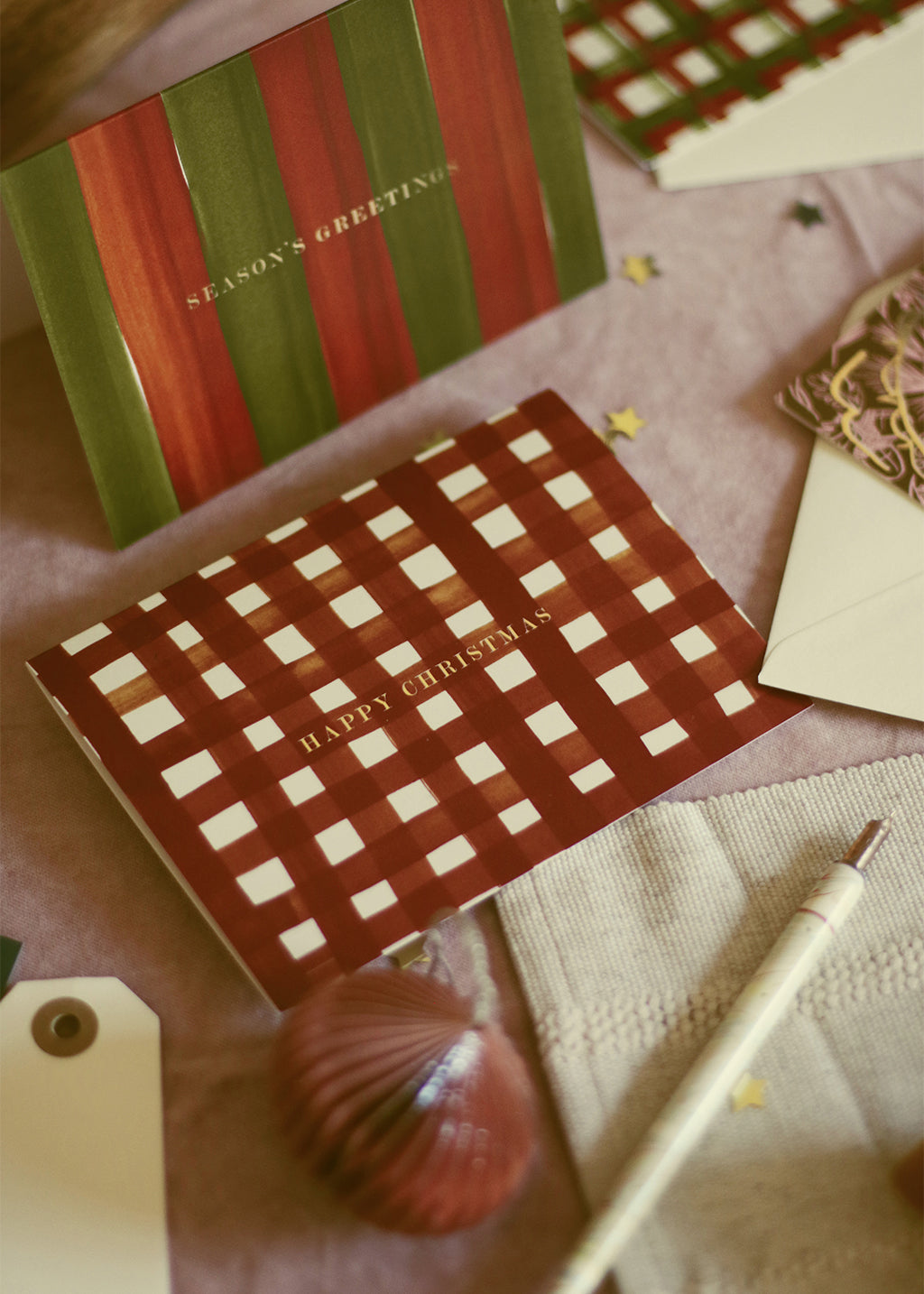 christmas cards in traditional green and red hues with gold foil lettering