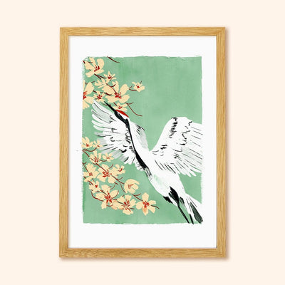 A Full Colour Giclee Print Featuring a Crane And Cherry Blossom On A Teal Background In A Light Oak Frame - Annie Dornan Smith