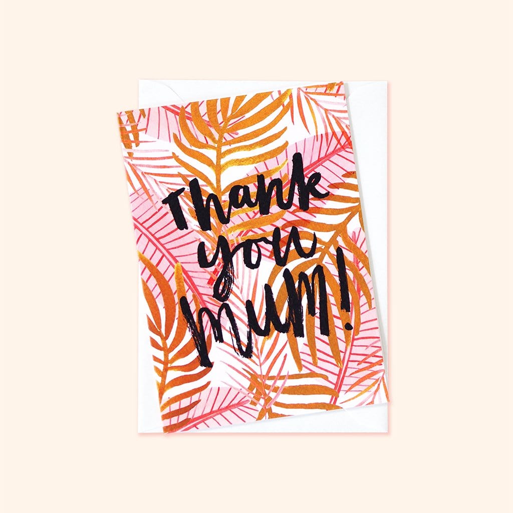 An Illustrated Pink Palm Leaf Card With The Words Thank You Mum In Brush Lettering With A White Envelope - Annie Dornan Smith