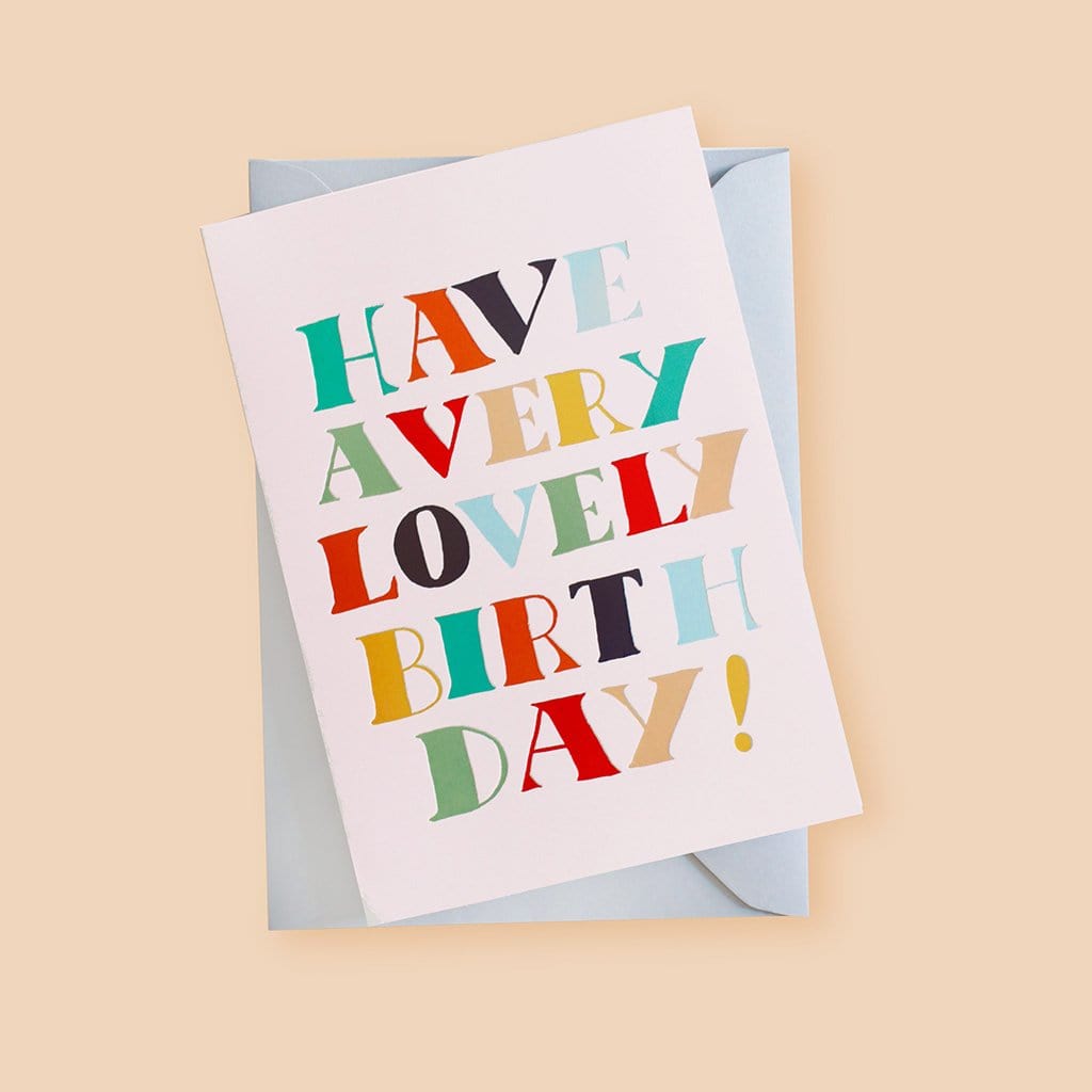 A Hand Lettered Rainbow Typography Card Reading Have A Very Lovely Birthday With A Pale Grey Envelope  - Annie Dornan Smith