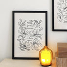 a minimal, floral print reads "just because i love you" surrounded by black lineart style flowers