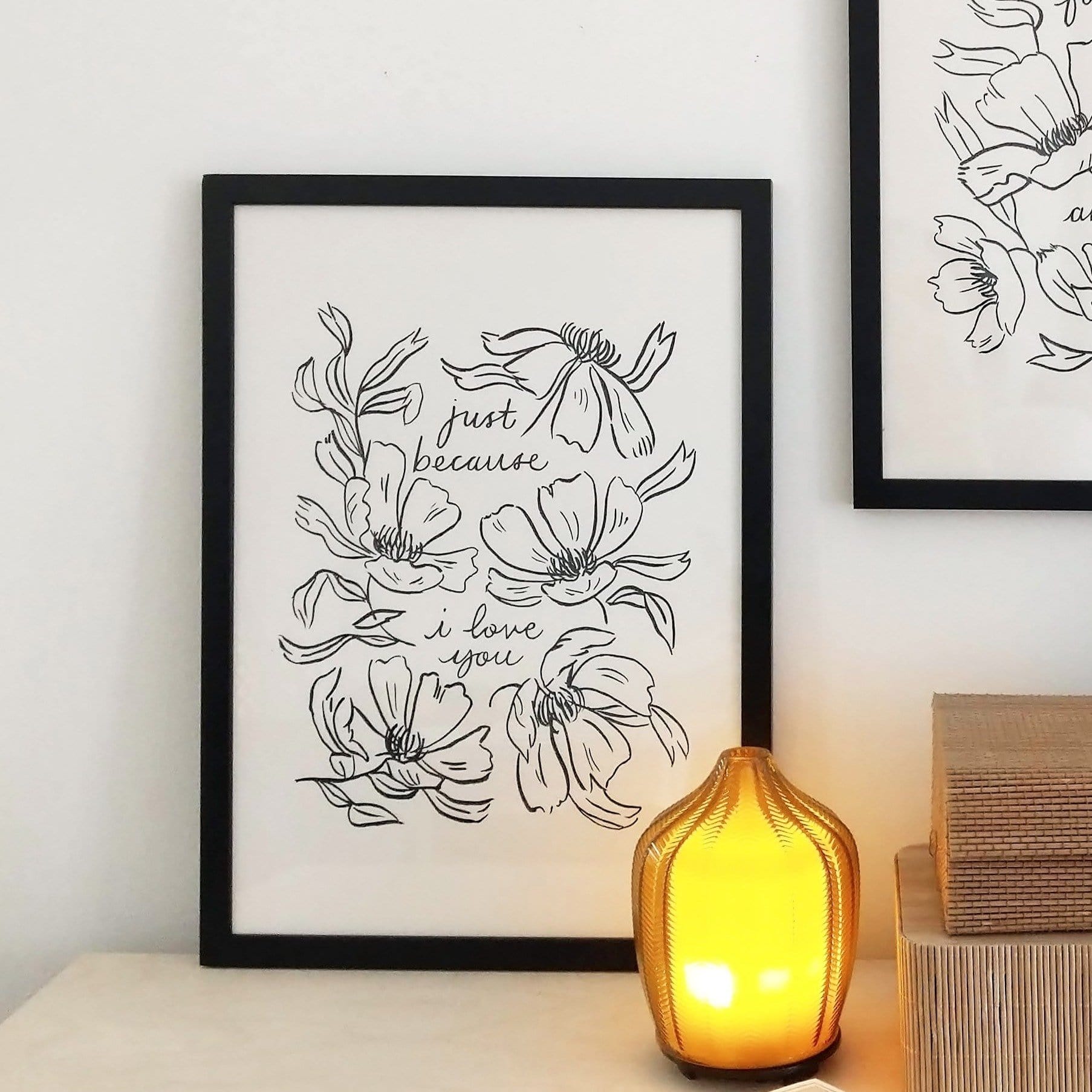 a minimal, floral print reads "just because i love you" surrounded by black lineart style flowers